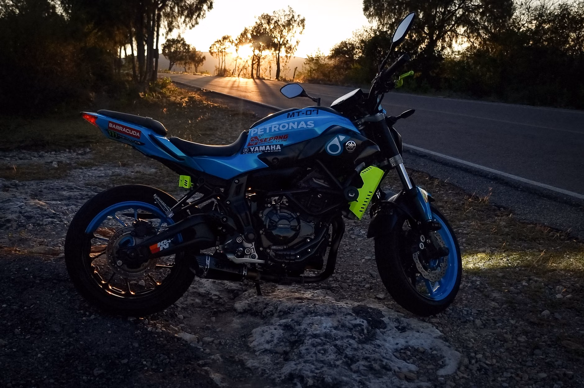 A vibrant motorcycle captured against a stunning sunset in San Luis Potosí, Mexico.